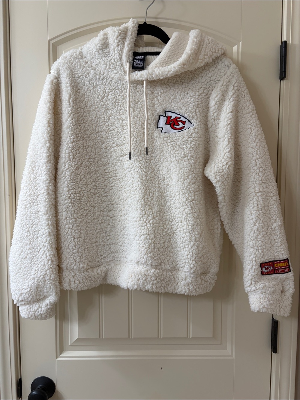 NFL Ivory Sherpa Hoodie Tag Detail - NFL Team Apparel